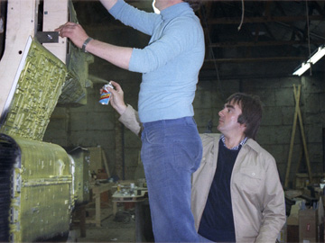 Brian Johnson helps with the final touch up of Yellow Nostromo before test shoot